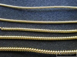 Examples of pearl purl gold work.