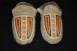 Pair of Esquimeaux Indian moccasins decorated with black, red and white porcupine quill work on the vamp. Acquired from the Hudson's Bay Company (early 19th century).