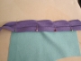 Example of bias binding being sewn onto another textile.