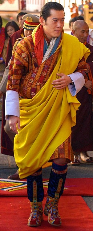 The King of Bhutan wearing the traditional tshoglham boots.