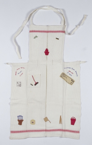 Embroidered apron from Japanese internment camp in Jakarta, Dutch East Indies.