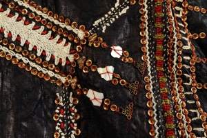 Detail of a dress from the Tihamah region, Yemen, decorated with applied mother-of-pearl. mid-20th century.