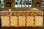 The Khaki altar cloth: An altar superfrontal worked in cross stitch on linen, made by the Khaki Club, now in Bradford Cathedral.