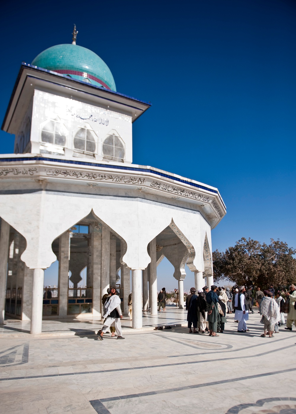 American and Afghan officials at the Shah Maqsud shrine in Khakrez, 2010. Photograph public domain.