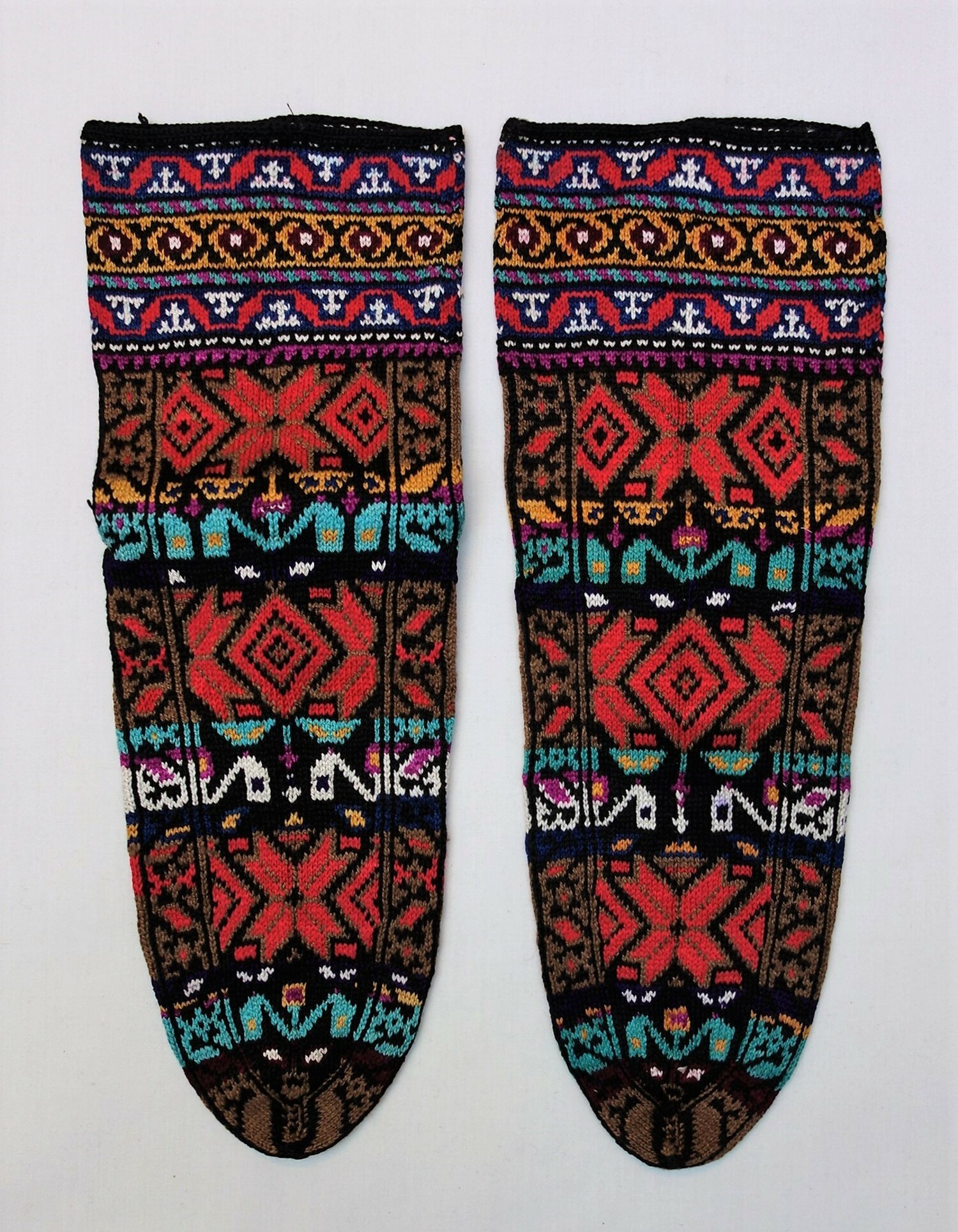 Late-19th century, silk, knitted socks from Iran (TRC 2002.0078a b).