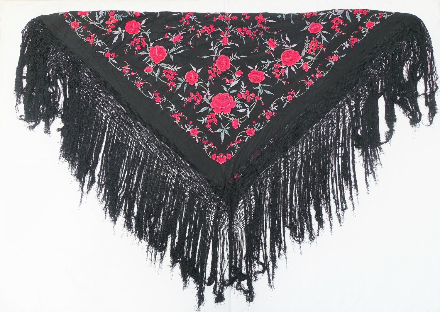 Manilla shawl, from Spain, with Chinese-style embroidery and traditionally made and exported via Manilla on the Philippines (TRC 2012.0015).