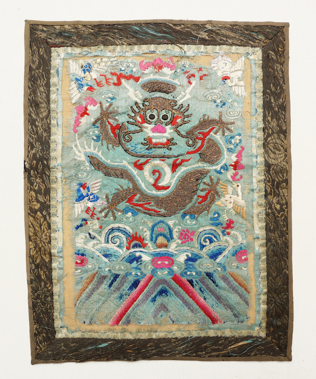 Fig. 5. Rectangular panel with a stylised dragon in metal thread, plus red, white, blue and pink (floss) sik threads, China, before 1930 (TRC 2012.0084).