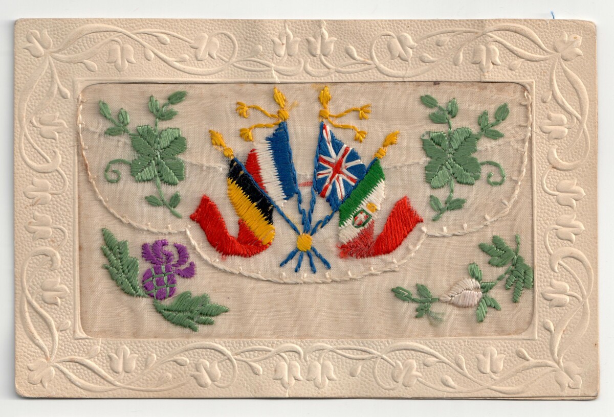 Machine embroidered postcard from the First World War, with flags from various allied nations (TRC 2015.0419).