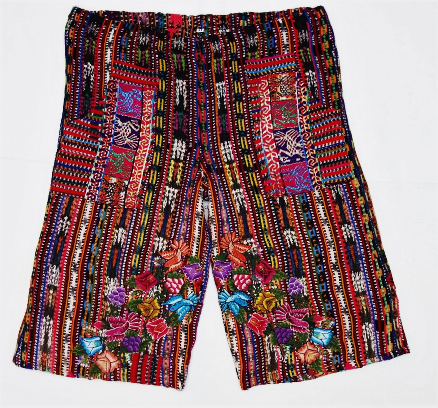 Guatemalan pair of man's trousers, locally dyed (ikat) and woven, hand embroidered, 2011 (TRC 2019.2835).