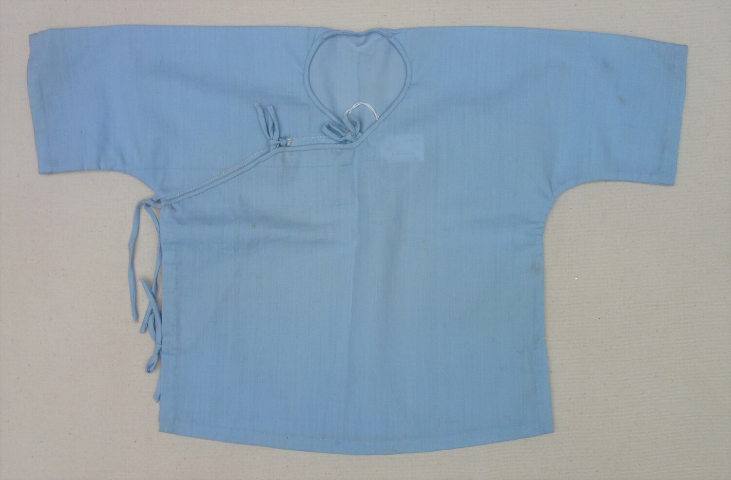 Small jacket for a baby, distributed among Vietnamese refugees on the island of Pulau Tengah, Malaysia, late 1970s (TRC 2021.0147a).