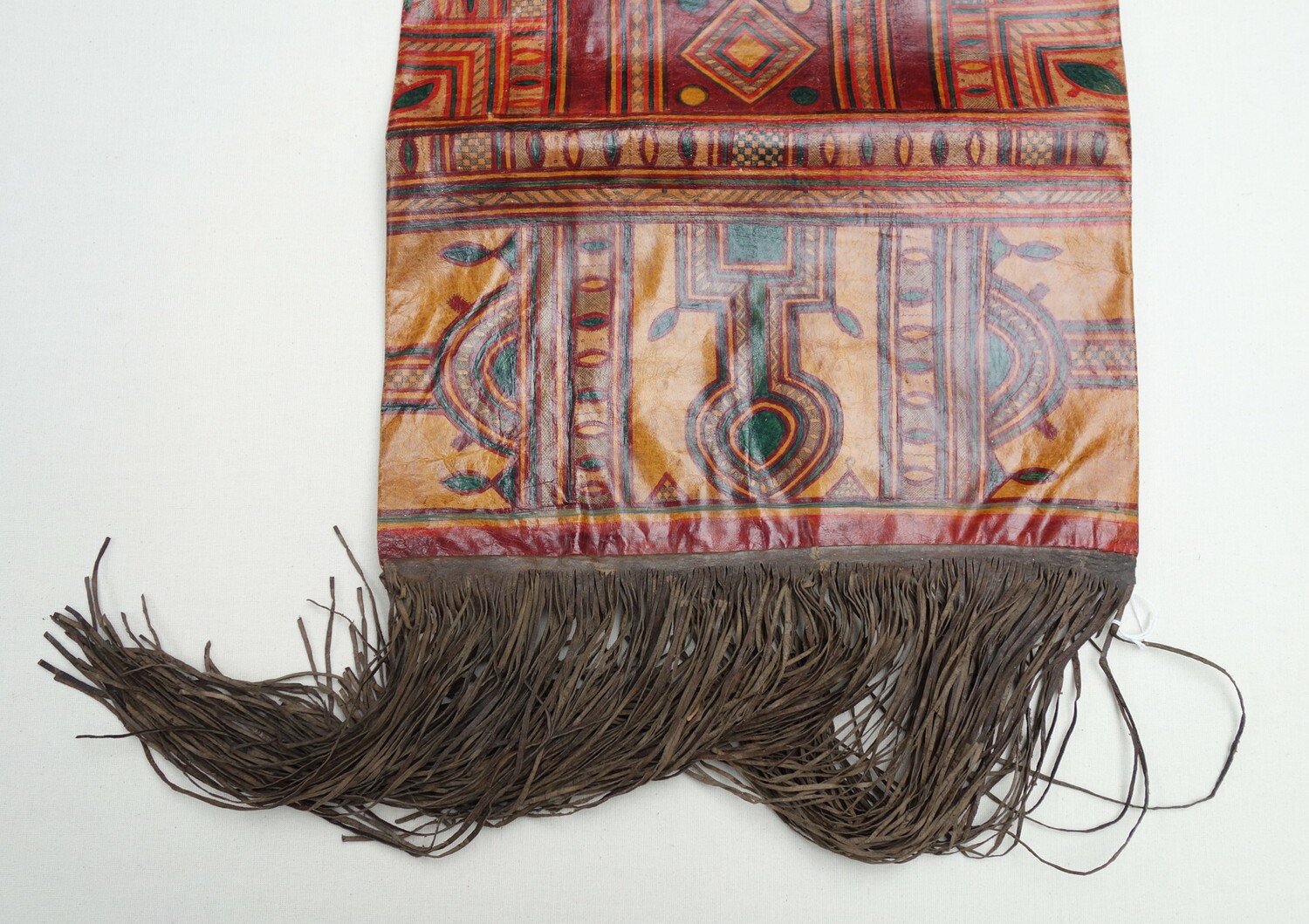Detail of 1980s leather and painted cushion cover from Mali (TRC 2021.2115).