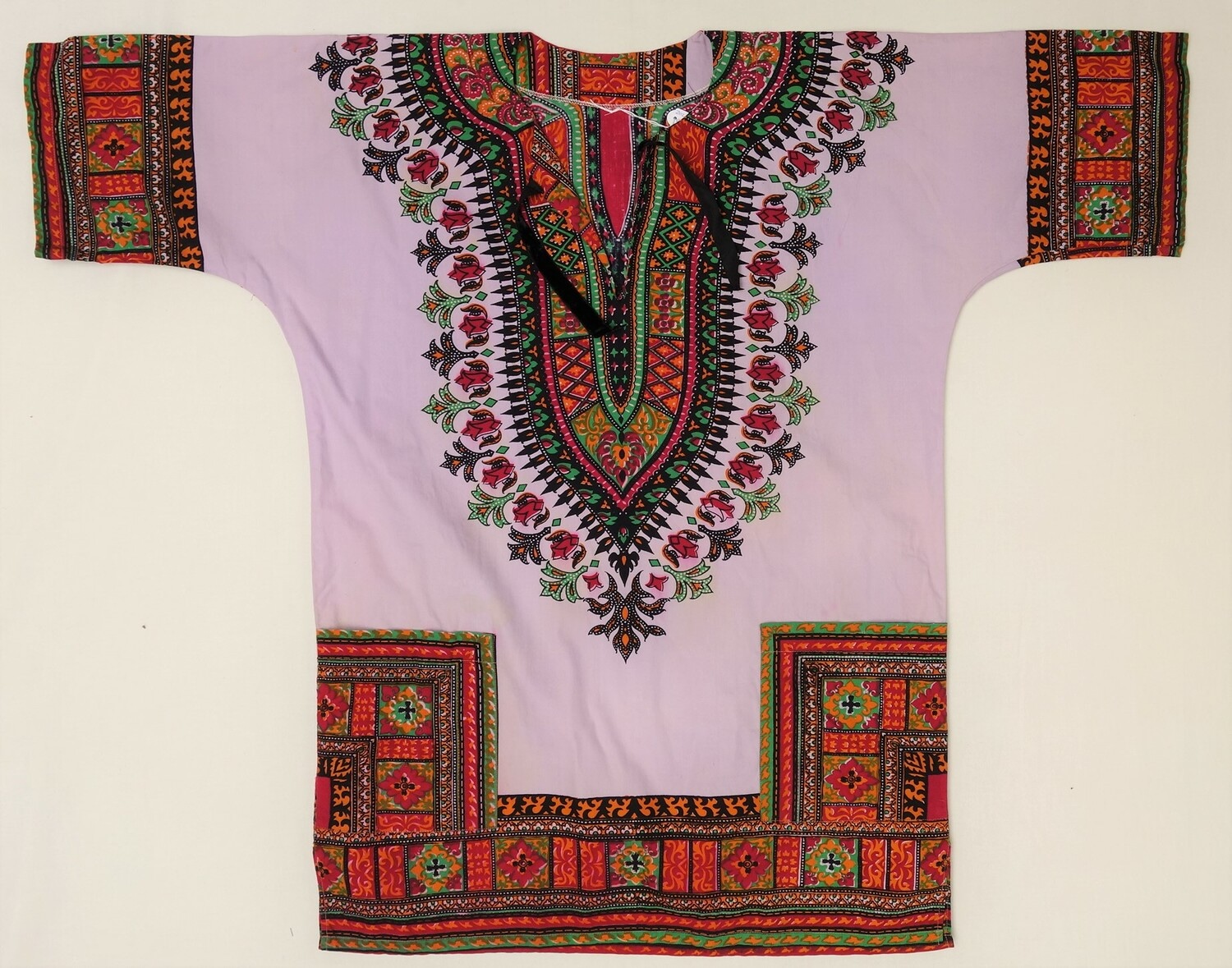 West African shirt (dashiki). The decorative pattern originates from Ethiopia in East Africa. 1960s. (TRC 2021.2516).
