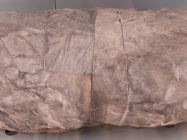 Decorative stitching on goat leather mummy wrapping, Tenerife. Photo by Shelley Anderson.
