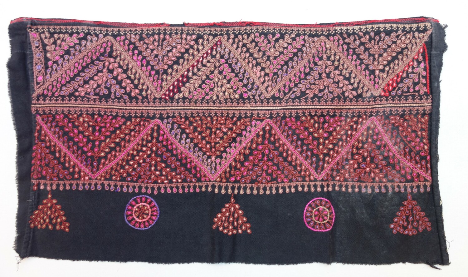 Part of an embroidered cushion cover, Palestine, 1920s (TRC 2025.0007).