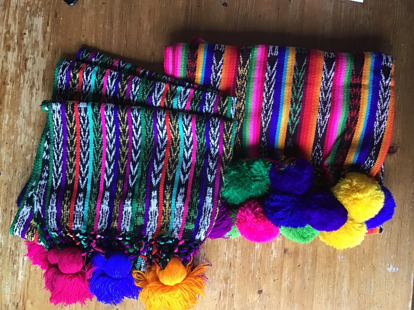 The first additions to the TRC Collection in 2026: Two hand-woven Guatemalan ikats decorated with large pom-poms and tassels. Guatemala, late 20th century (TRC 2026.0001 and TRC 2026.0002).