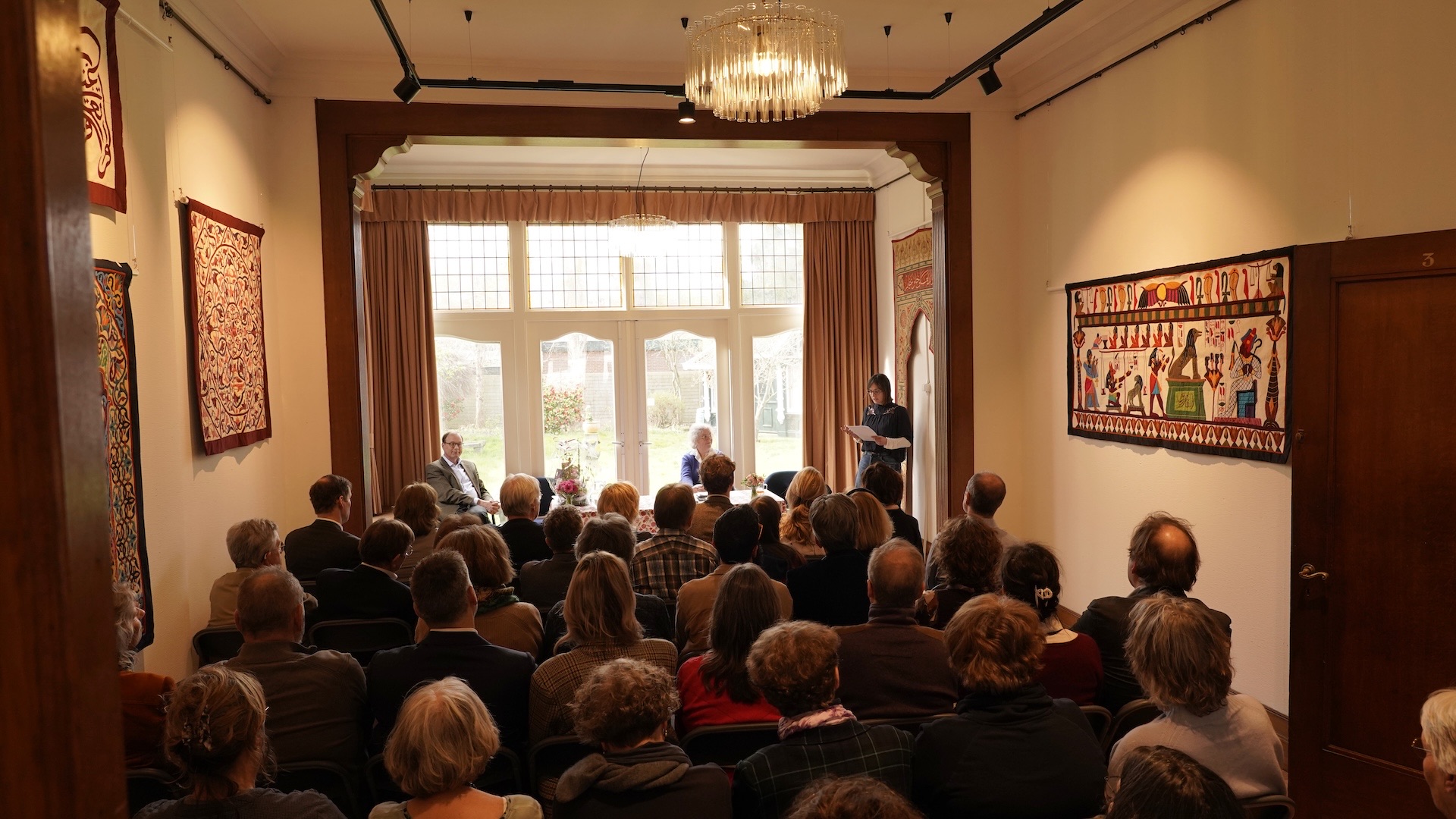 The audience listening to Daan van Dartel, curator of the Wereldmuseum, who speaks about the role and importance of embroidery. Copyright Joost Kolkman.