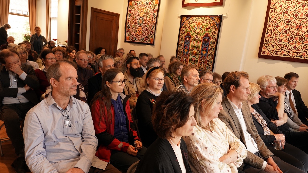 Guests sitting in the exhibition space at the TRC listening to various talks. Copyright Joost Kolkman.