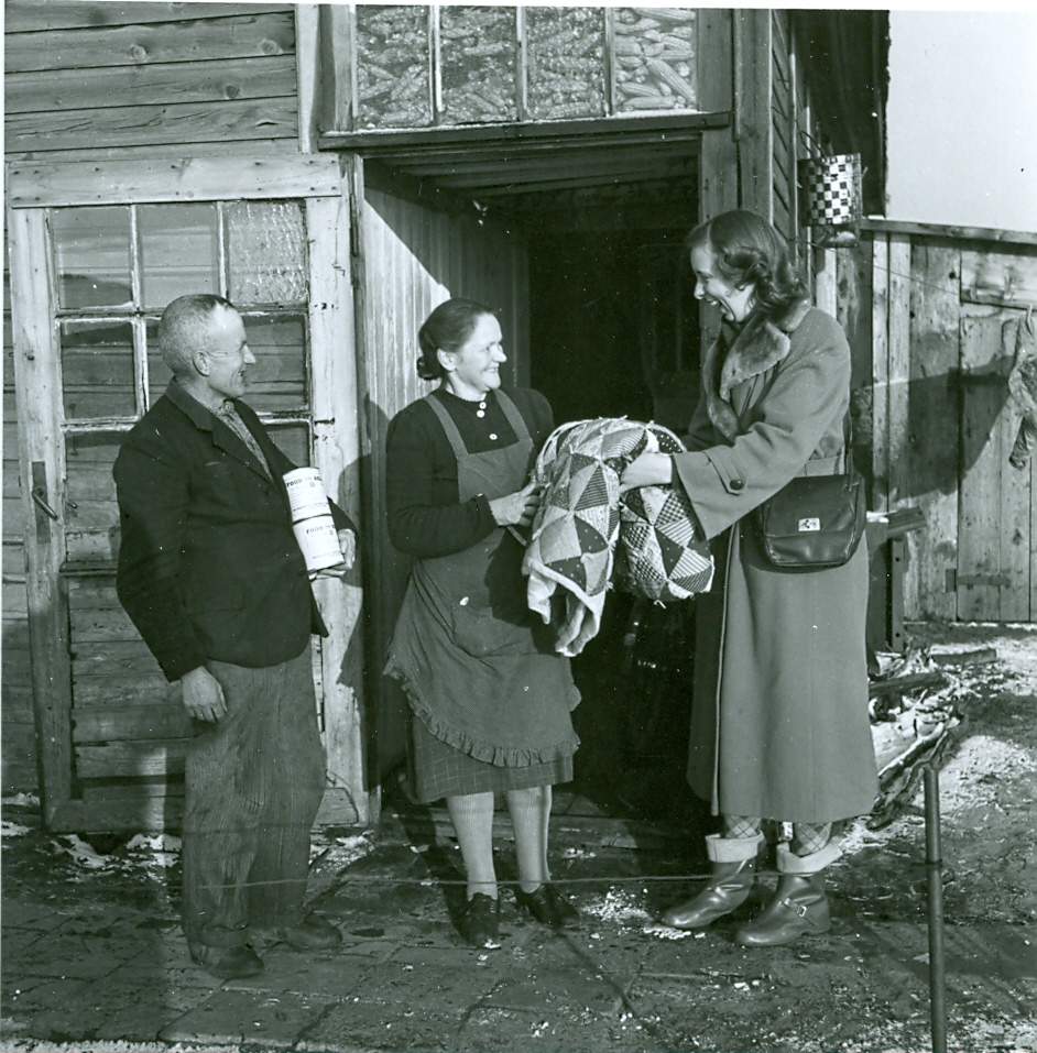 Distributing comforters among those in need in post-war Europe.
