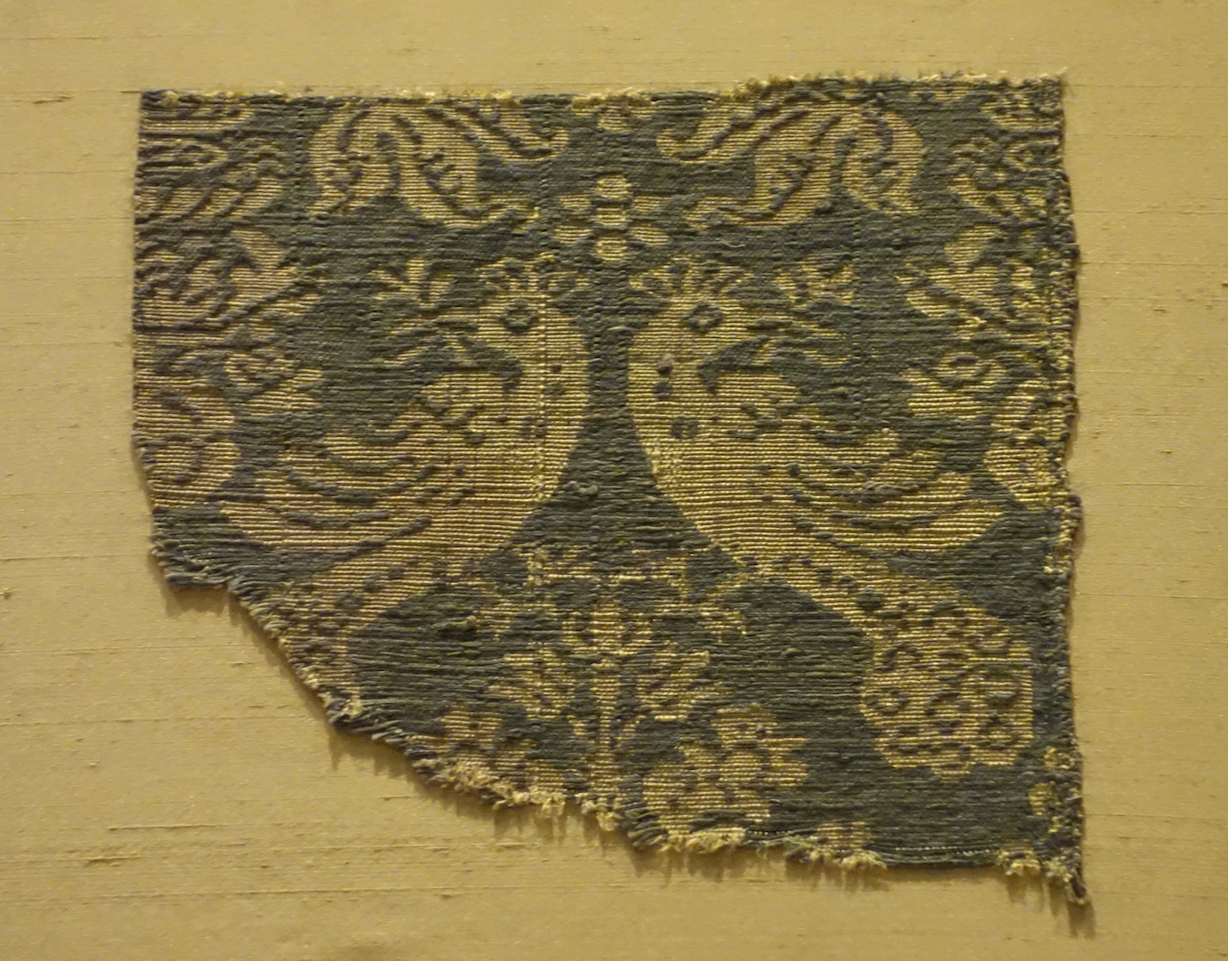 Fragment of a silk cloth with paired birds. 14th century, Italy.