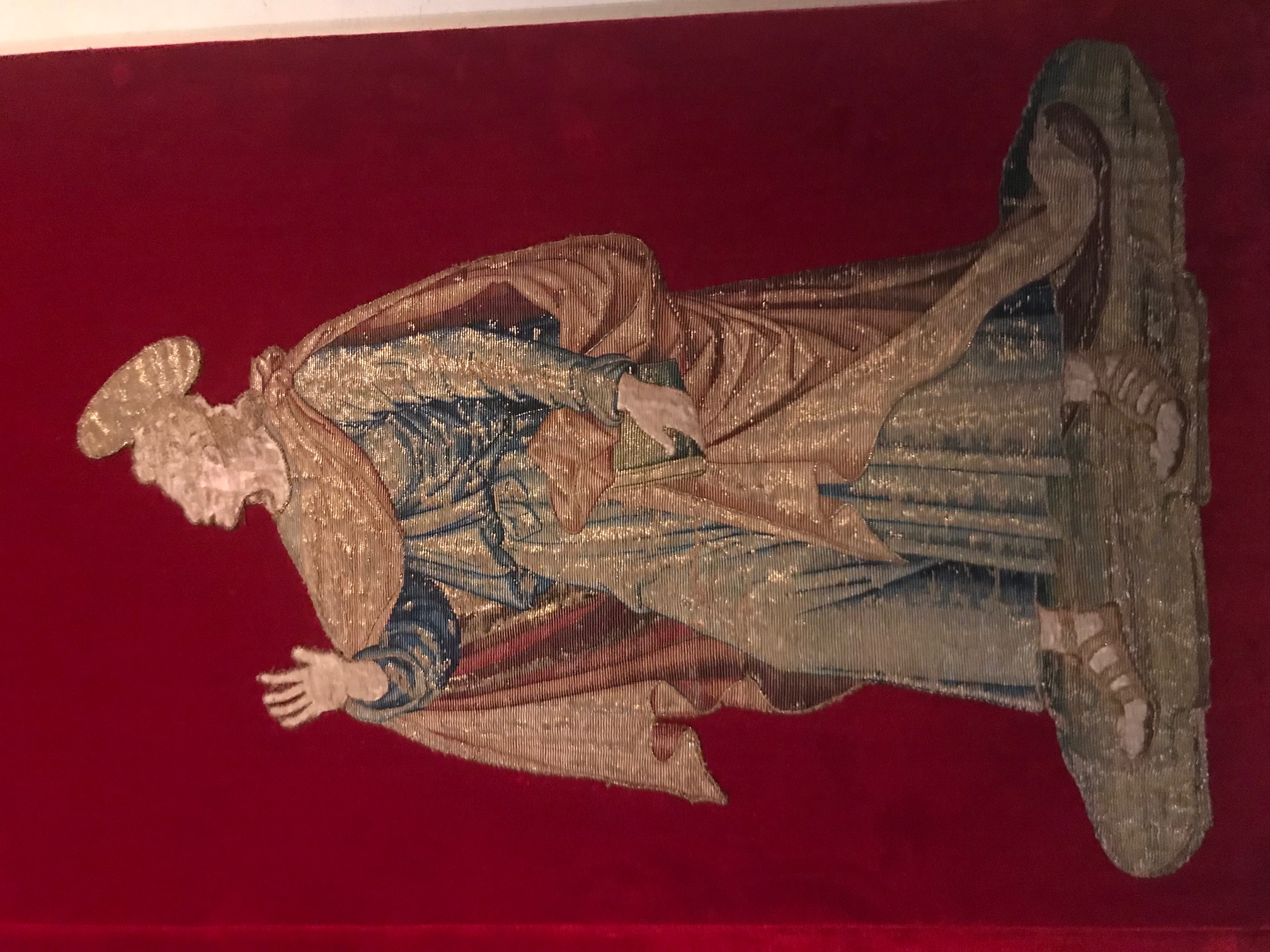Or nué embroidery of a female saint, Courtesy Sens Museum, 15th century.