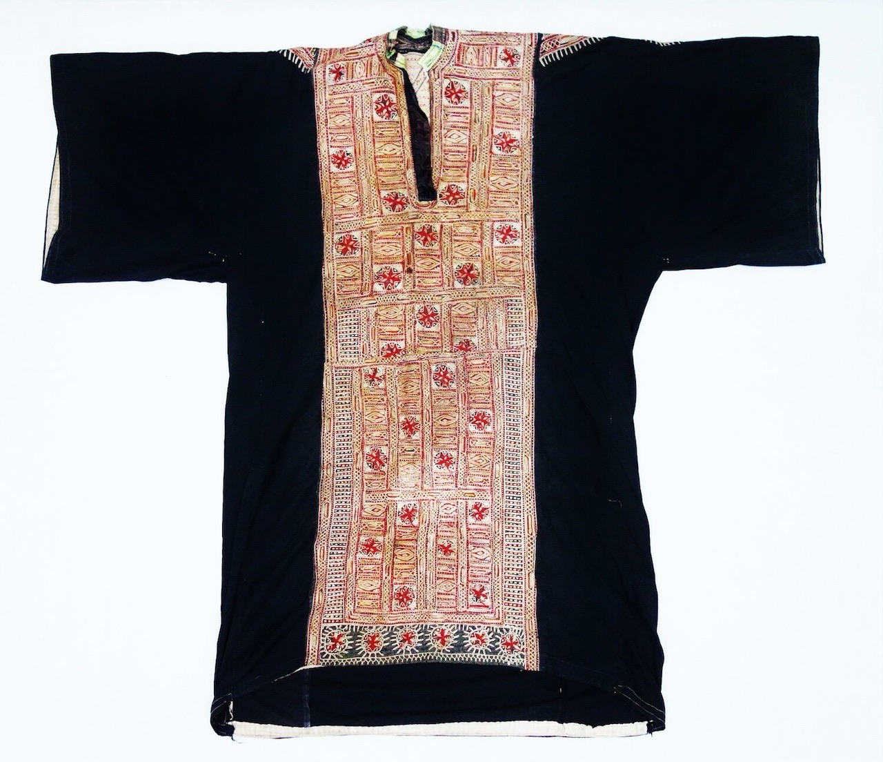 Fig. 2. Woman's hand and machine-embroidered dress, 20th century, from the Jebel Milhan region, west of Sana'a, Yemen (TRC 2011.0147).