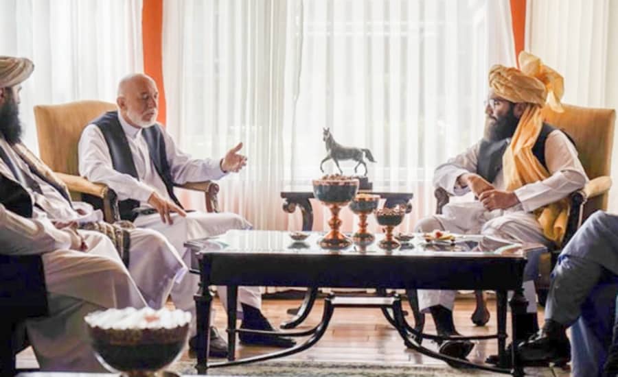Hamid Karzai (left) in talks with the new Taliban rulers of Afghanistan, August 2021.