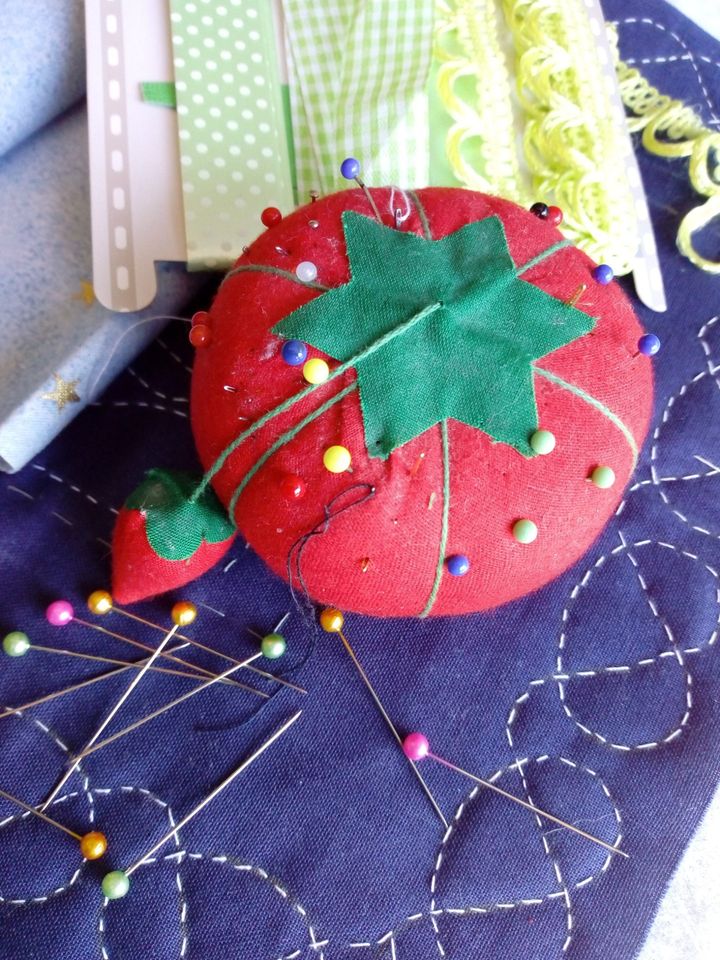 Pin cushion in the shape of a tomato, owned by the author.
