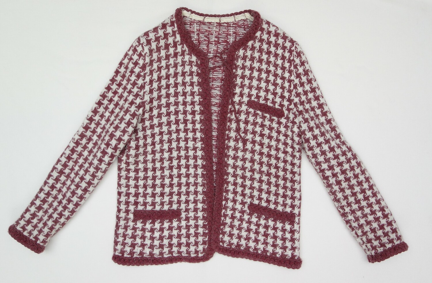 Hand knitted, woollen jacket, Romania, 1970's and 1980's. Donation Radu family (TRC 2020.0347a). The jacket and skirt were made in the style of the fashion house of Chanel. in Paris.